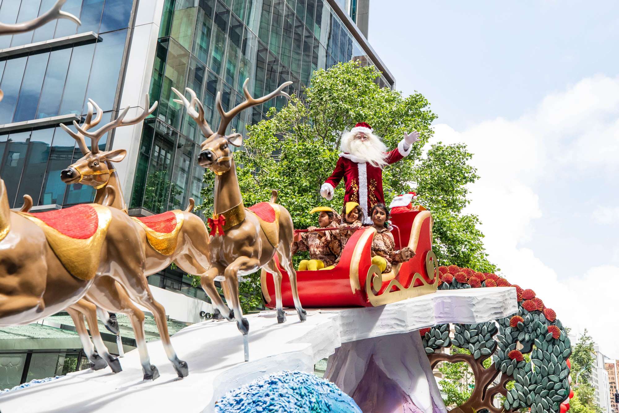 Santa and reindeer float at Farmers Santa Parade