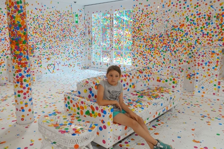 Joining the dots in The Obliteration Room by Yayoi Kusama at Auckland Art Gallery