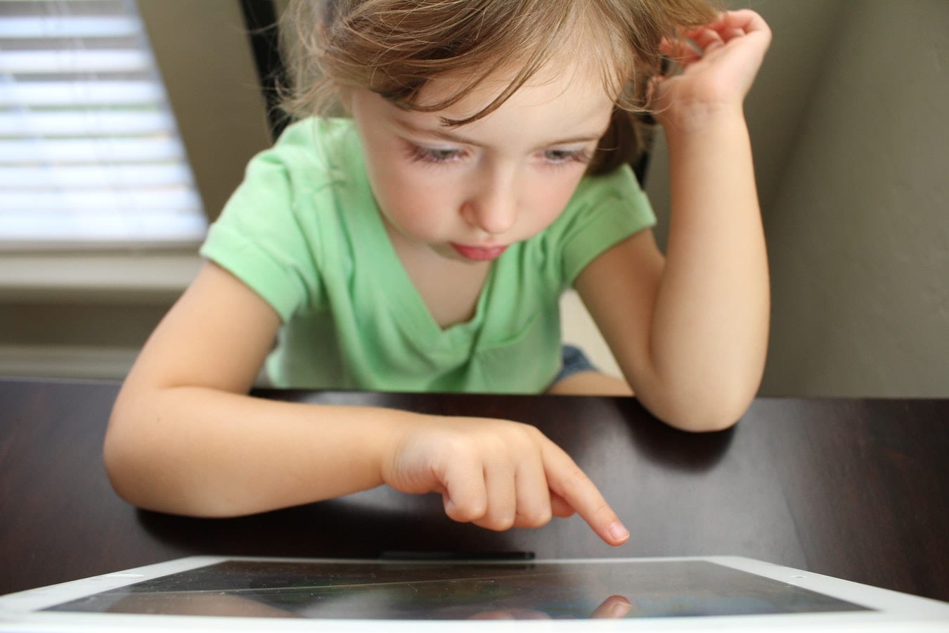 Girl playing on tablet