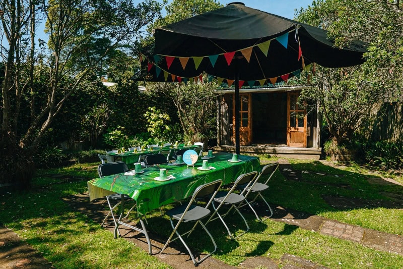 Table set up in a garden for a birthday party
