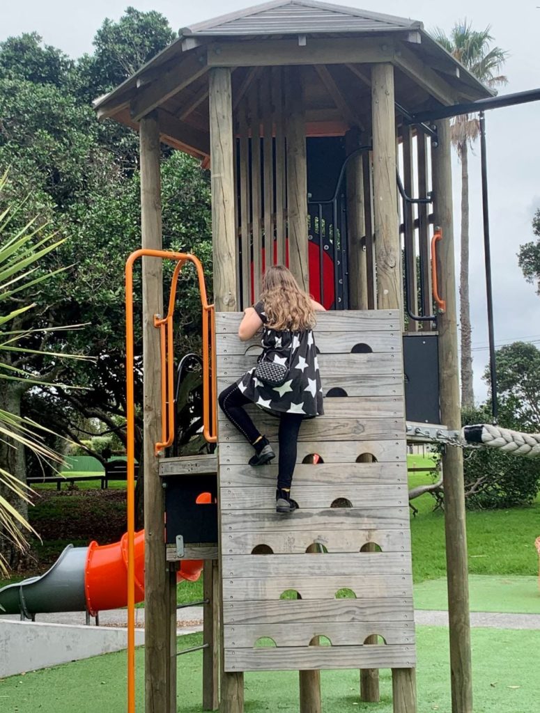 Child climbing on the Mt Wellington playground in Panmure, NZ