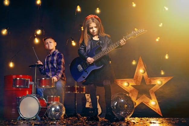 Children playing in a rock band