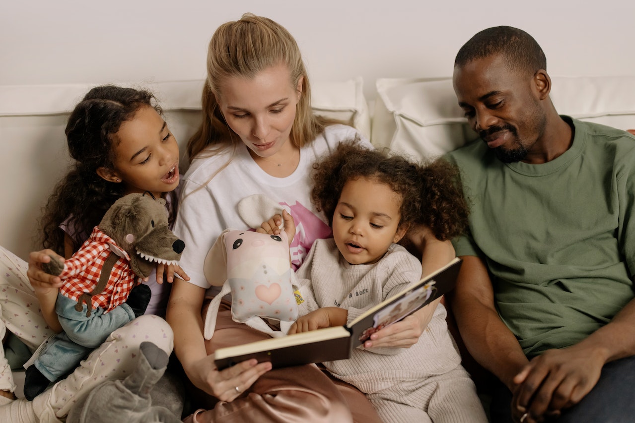 Family Reading Book with their Mum
