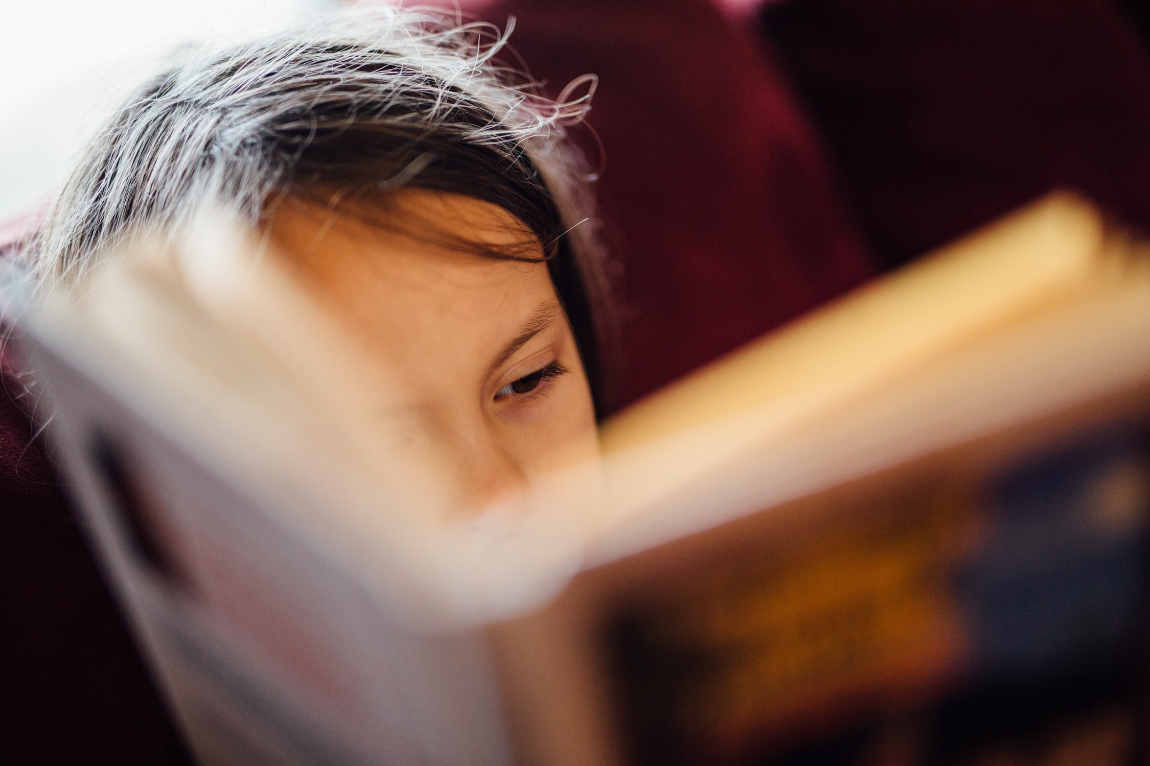 Girl reading a chapter book