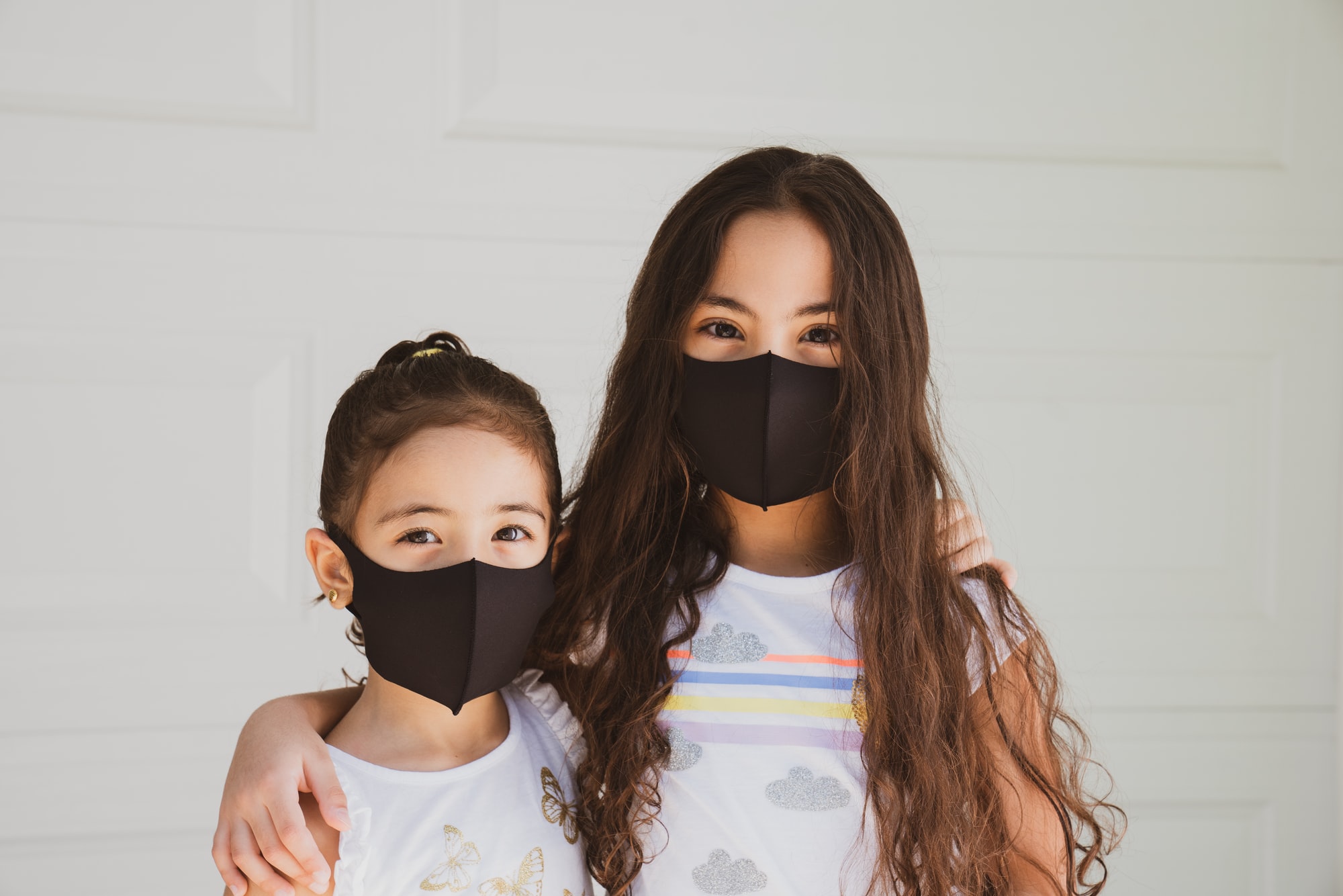 Mother and daughter with mask