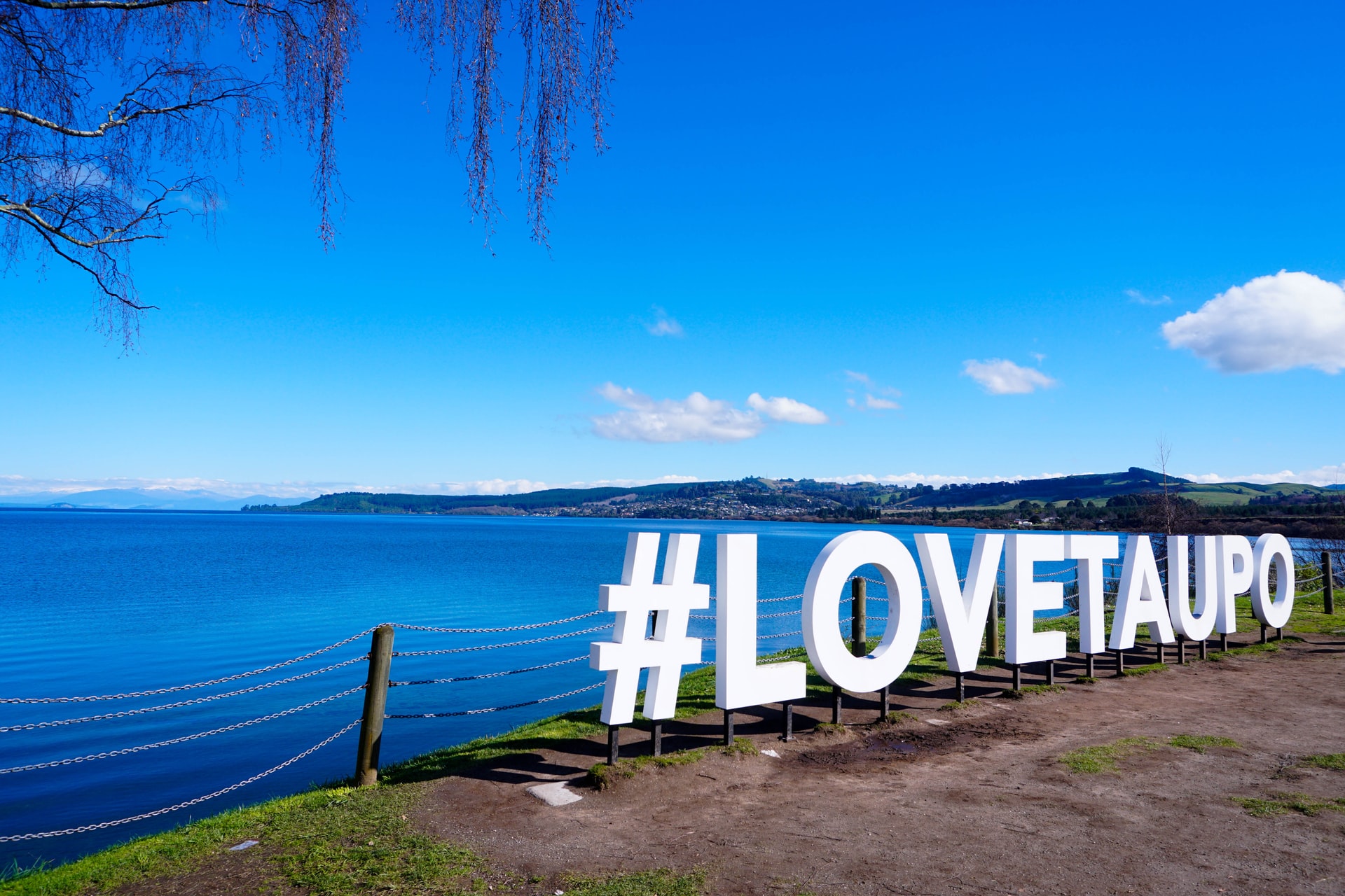 Love Taupo sign next to Lake Taupo