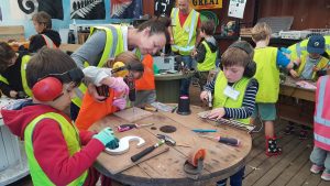Children making things from waste