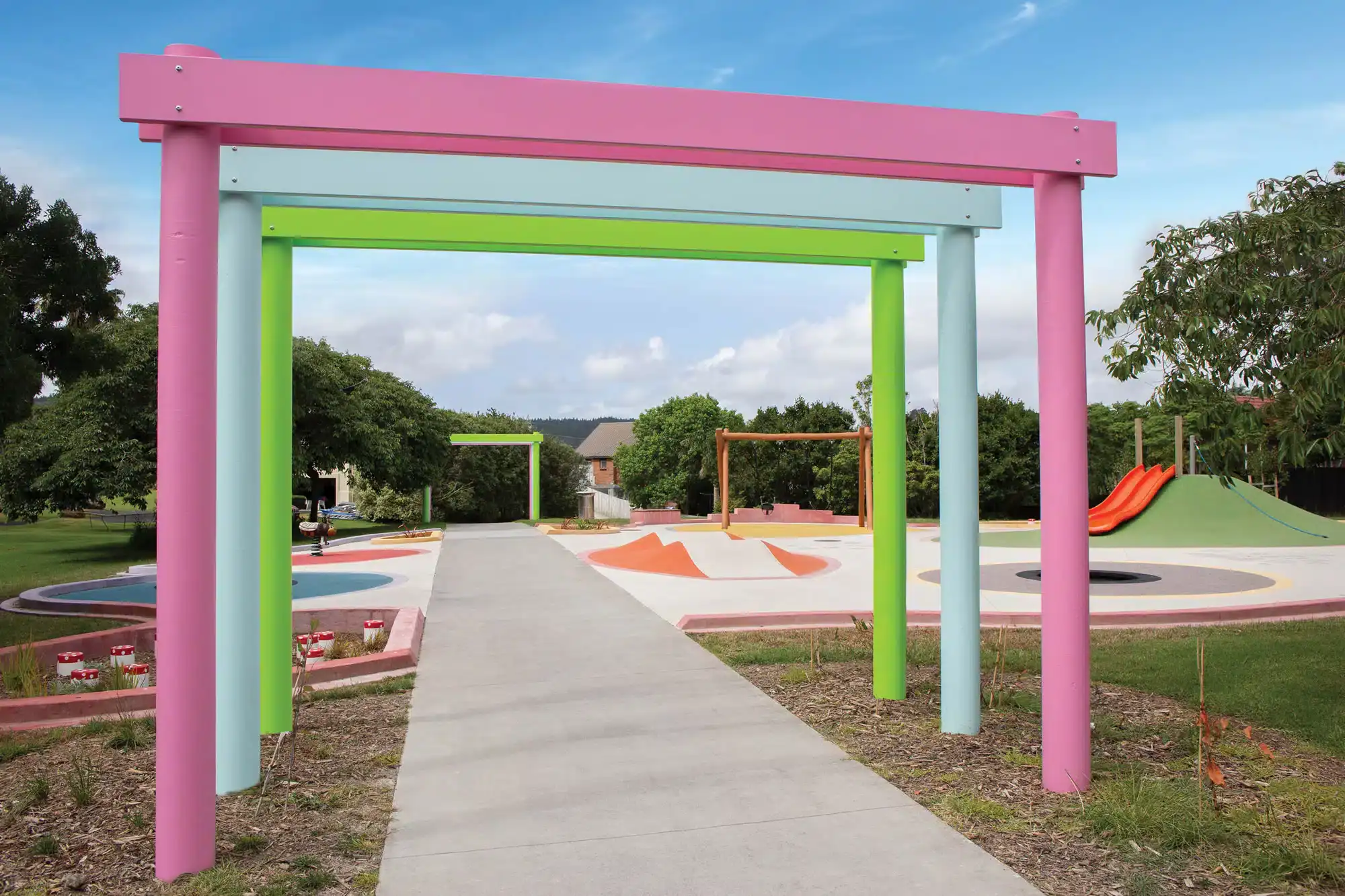 Bright pastel arches leading to colourful play areas at Sunny Crescent Playground in New Zealand | Photo: Playground Centre