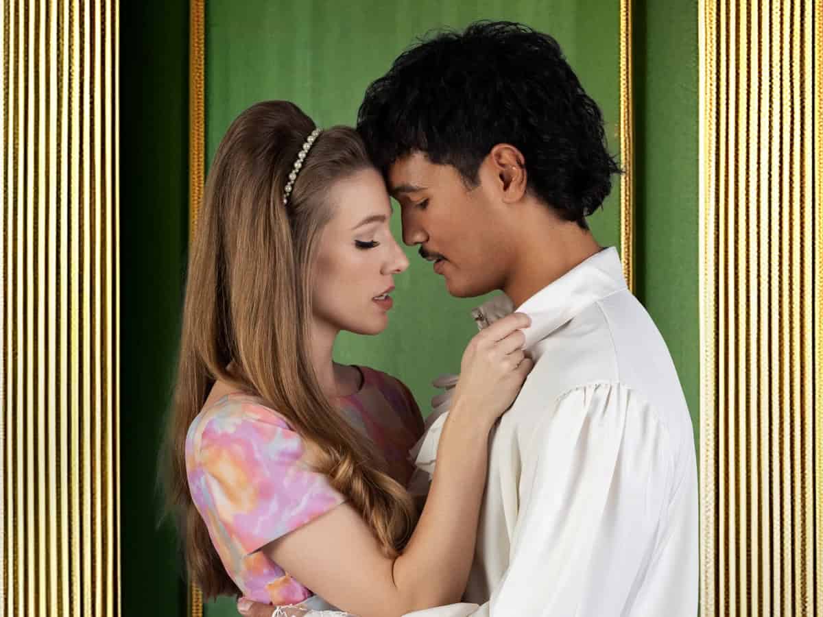 Two young actors portray Romeo and Juliet in a romantic scene from Auckland Theatre Company’s performance.