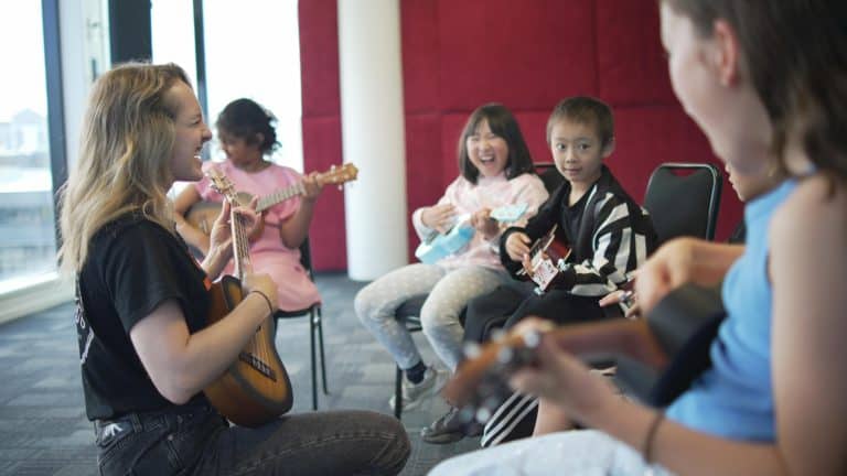 Children playing ukulele in a music class