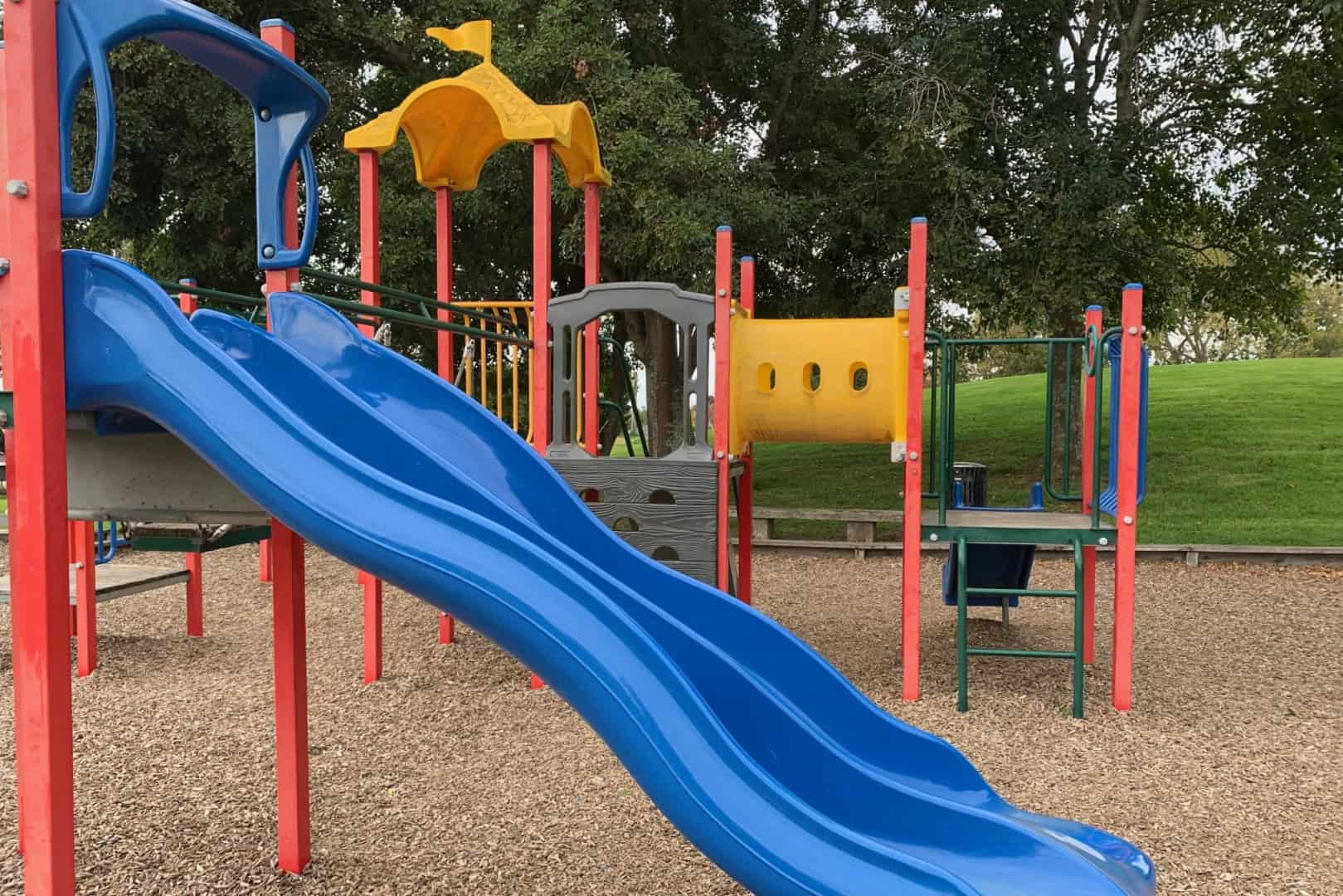 Brightly coloured slides and climbing frames at Little Rangitoto Reserve, Remuera
