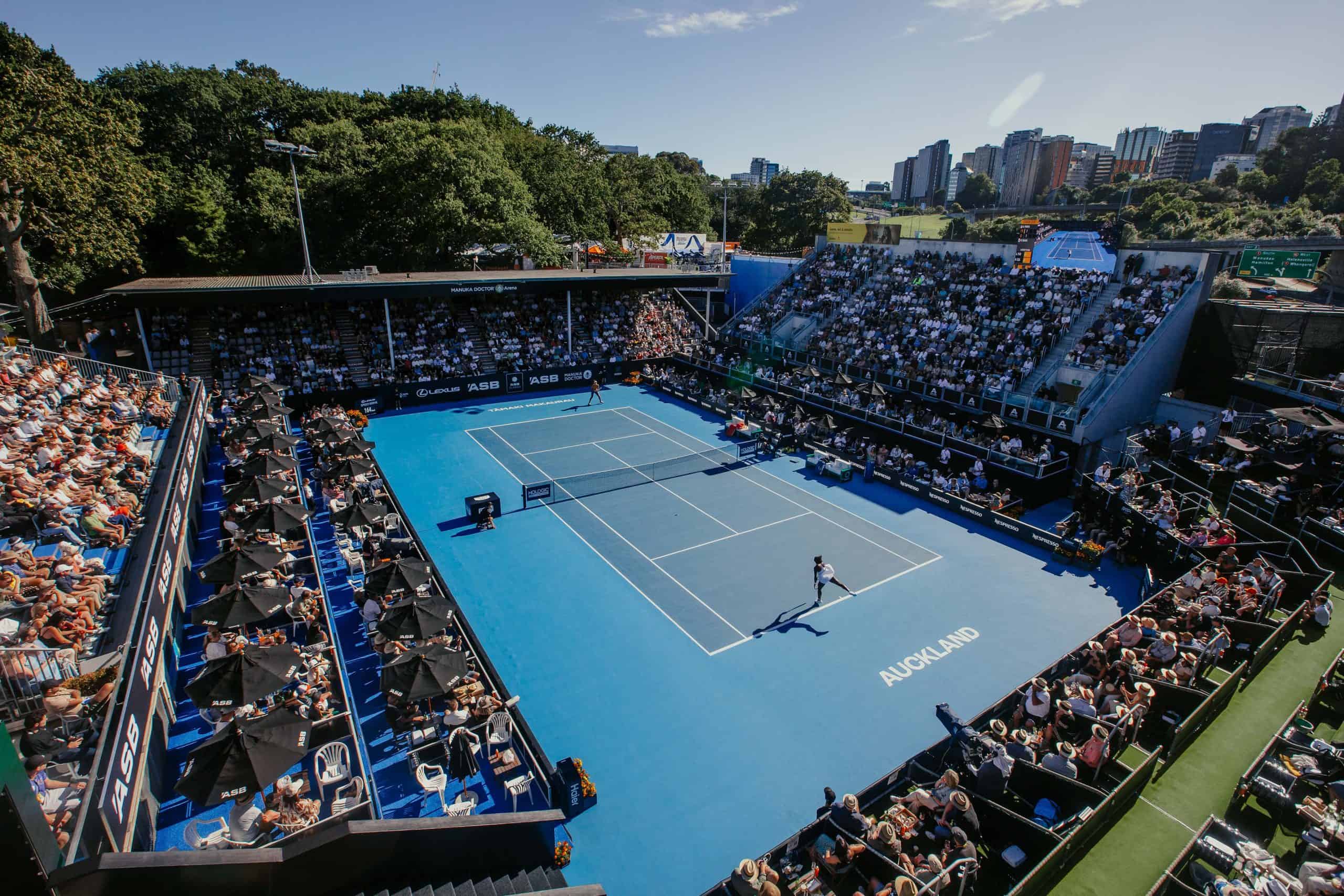 Wide view of a packed centre court at the ASB Classic in Auckland on a sunny summer day